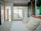 A cosy guestroom at Mogi boutique hotel