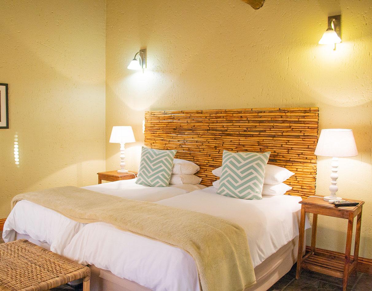 Warm iluminated double bedroom.