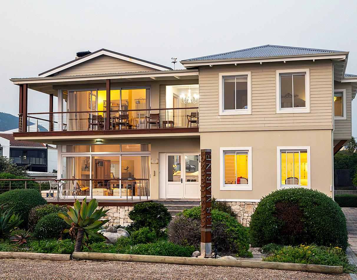 Front view of 138 Marine Beachfront Guesthouse lit up at dusk, Hermanus.
