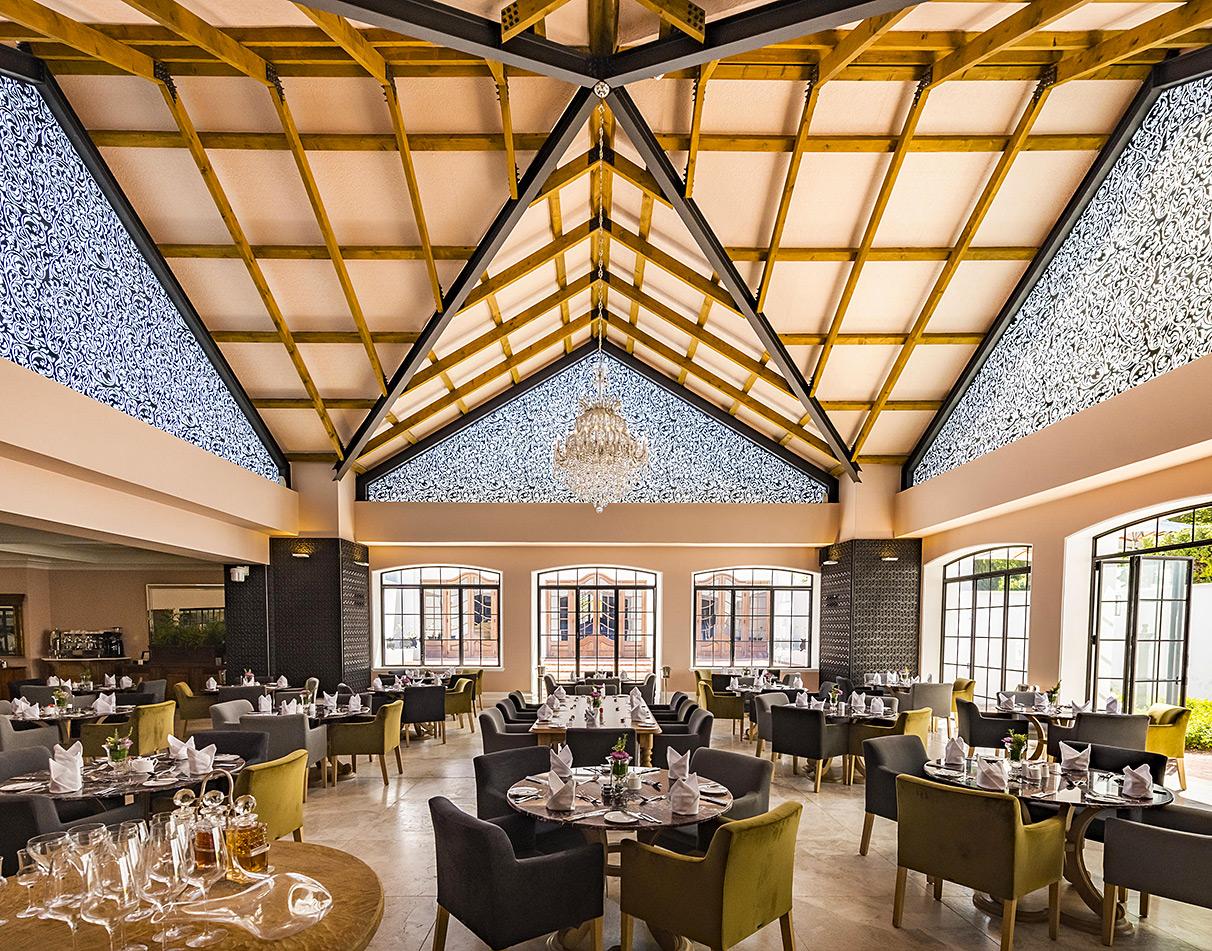 The open and atmospheric dining area of Lanzerac, Cape Winelands.