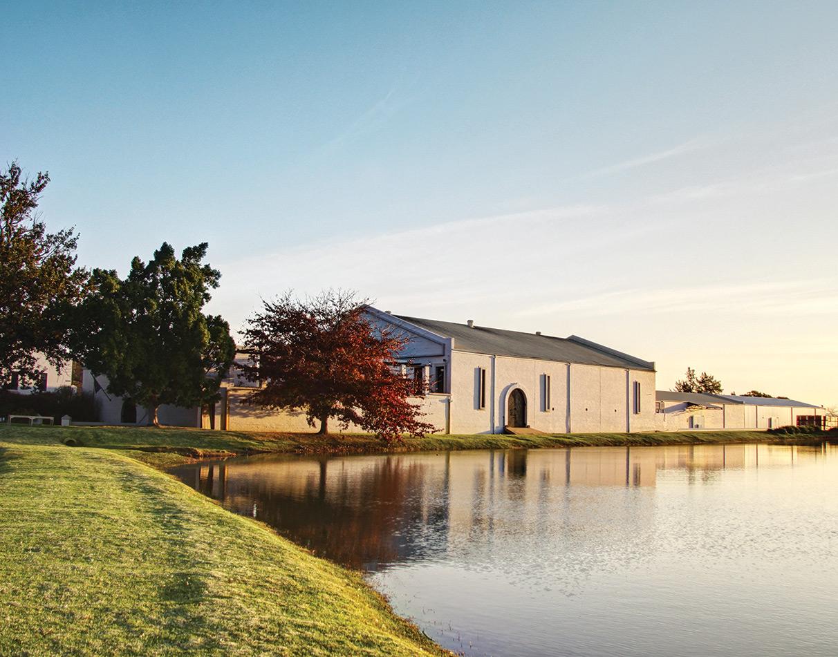 The main building of L'avenir on a lake in Cape Winelands, South Africa.