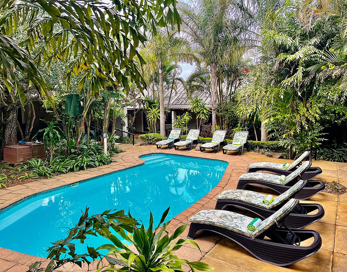 The pool area of Lidiko Lodge in the forest.