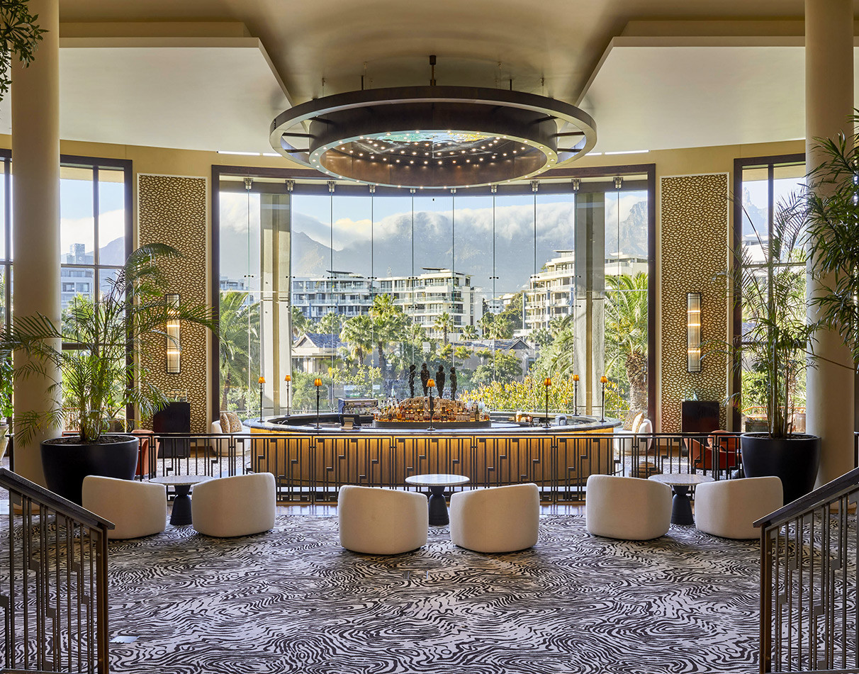 legant hotel lobby lounge with circular bar and Table Mountain views at One&Only Cape Town.