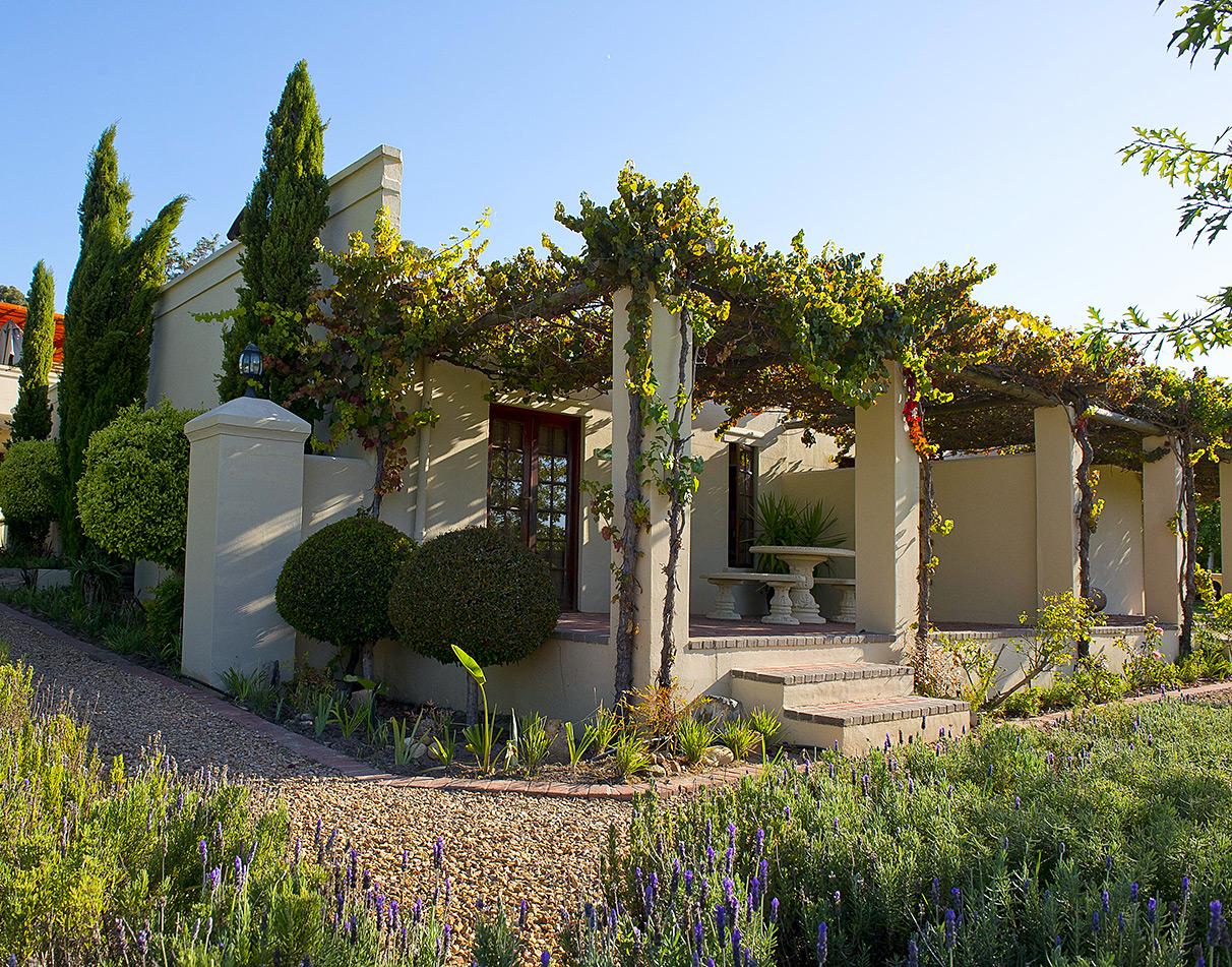 Exterior building at Cultivar Guest Lodge surrounded by greenery.