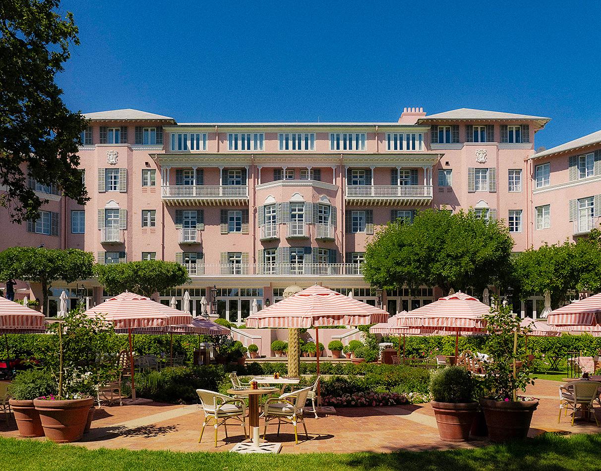 Pink building facade at Mount Nelson Hotel with garden entrance.