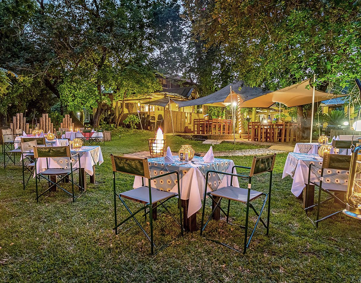 Outdoor garden dining setup at Gecko Lodge.