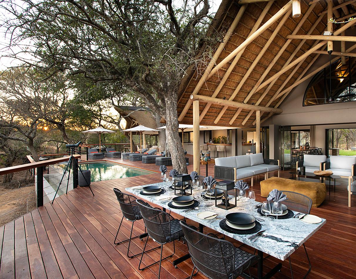 Serondella Lodge pool terrace lounge overlooking the bush.
