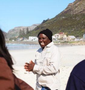 Happy South Africa Experience guide on the beach with a small group.
