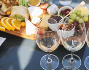 A wine tasting board with cheese and fruit pairings in the Cape Winelands, South Africa.