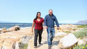 A couple on a romantic coastal walk in Cape Town, South Africa.