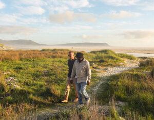 A guide leading guests on a private beach tour.