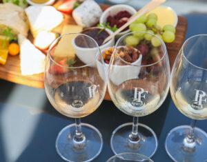 Wine tasting experience with food platter in Stellenbosch.