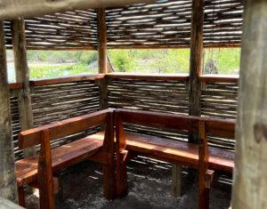 Interior of a game reserve photography hide overlooking the bush.