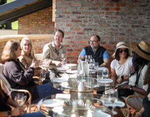 Small group enjoying lunch and a wine tastig experience in South Africa.