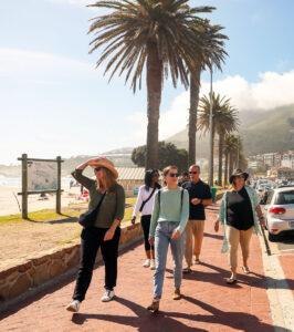 Guests on small group travel packages in South Africa on a scenic coastal walk, Camps Bay, South Africa