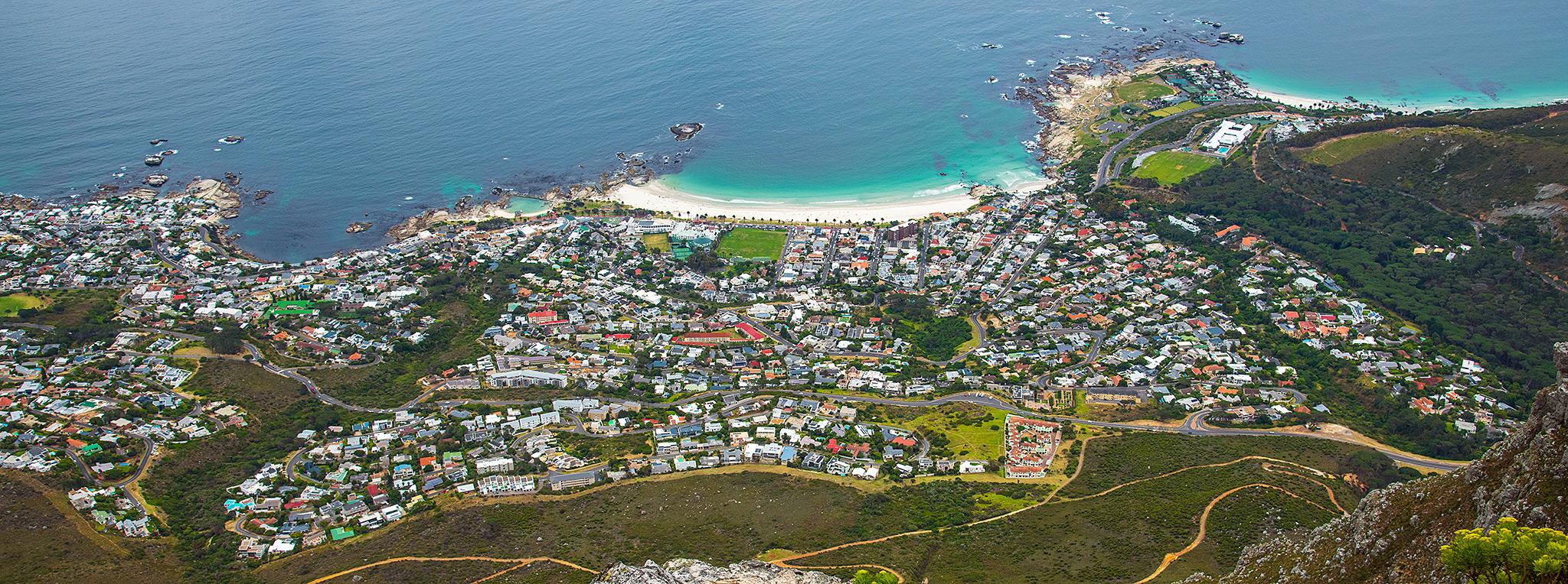 Aerial view of Camps Bay beach and suburb from the top of Table Mountain.