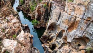 Smooth swirling rock formations carved by water at Bourke's Luck Potholes, Blyde River Canyon.