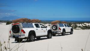 Self-drive 4x4 convoy on coastal dunes, South Africa.