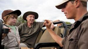 Father and son on safari in the Madikwe Game Reserve.