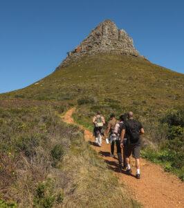 Small group hiking towards Lion's Head, Cape Town, South Africa.