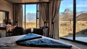 Bedroom with mountain view, perfect for guided hikes in South Africa.