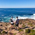 Two men on a coastal hike along the Garden Route.