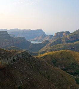 Layered mountain ridges and distant dam visible from a viewpoint on the Panorama Route, Blyde River Canyon.