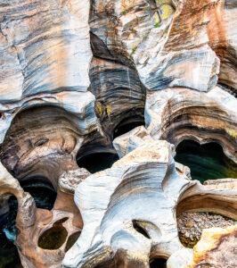 Close-up of swirling sandstone potholes carved by erosion at Bourke's Luck, Panorama Route.