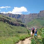 A group of travellers going on a hike in the mountains.