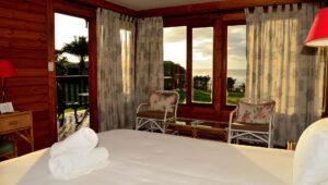 Cosy double room interior with ocean views at Mbotyi River Lodge, Wild Coast.