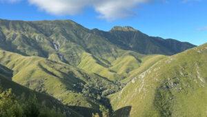 Lush green mountain ridges and valleys along Route 62, South Africa.