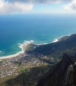 Aerial view of Camps Bay coastline and ocean from the top of Table Mountain, Cape Town.