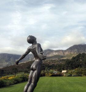Bronze sculpture on a Winelands estate lawn with misty mountain backdrop.
