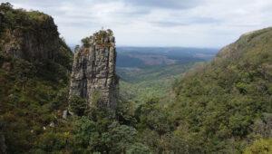 Pinnacle Rock formation rising above forested valley on the Panorama Route, Blyde River Canyon.