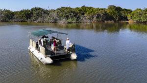 Guests on a photography boat cruise with Makakatana lodge.