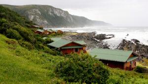 Wooden chalets overlooking the ocean at Storms River, Tsitsikamma.