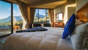 Double room interior with Drakensberg panorama views at Witsieshoek Mountain Lodge.