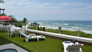 Pool deck with sea views at Greenfire Dolphin Coast Lodge