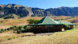 Log cabin lodge in mountains, Drakensberg, South Africa.