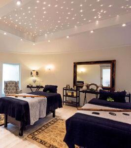 Luxurious spa treatment room with starlit ceiling at Kings Camp, South Africa.