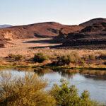 The Orange River winding through a desert landscape in Namibia.