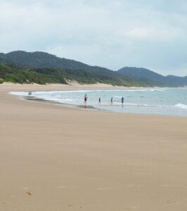 Wide sandy beach along the Hermanus coastline.