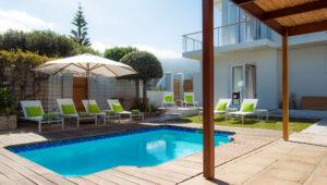 Poolside loungers at guest house, Bamboo Guest House, South Africa.