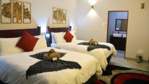 Double bedroom interior at a forest lodge.