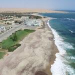 Aerial view of the Swakopmund coastline where the desert meets the ocean, Namibia.