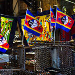Colourful flags and stalls at a local market in Eswatini.