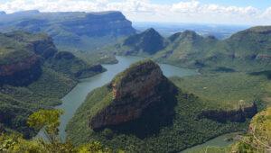 Aerial view of the Blyde River winding through lush green Blyde River Canyon, South Africa.