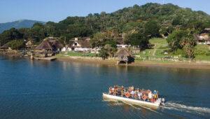 A boat cruise along the river past the thatched bungalows of Umngazi River Lodge on the Wild Coast.