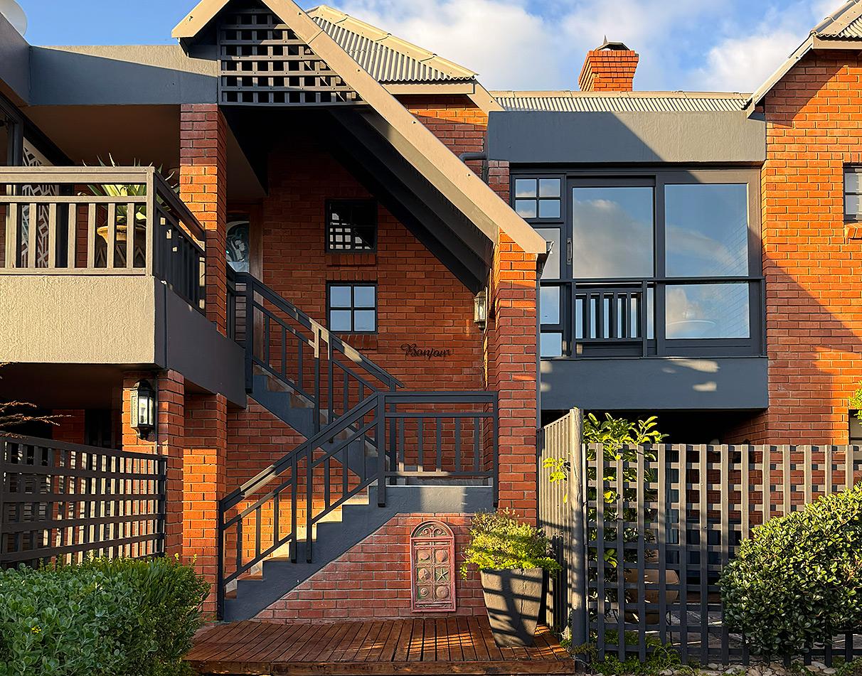 Front entrance and exterior of Dolphin Dunes Lodge, Wilderness.