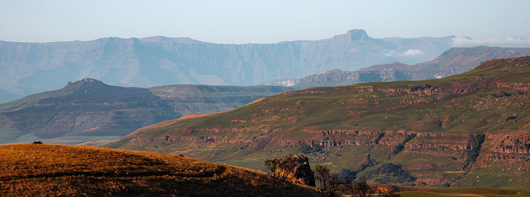 Layered mountain views across the Drakensberg range at sunrise, South Africa